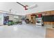 Spacious garage with ample storage, room for parking, and an automatic door opener at 3285 Majestic Oak Dr, St Cloud, FL 34771
