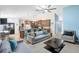 Open concept living area showcasing the kitchen with wooden cabinets, a breakfast bar, and neutral accents at 3285 Majestic Oak Dr, St Cloud, FL 34771