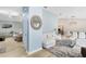 Open living space featuring a vaulted ceiling, hardwood floors, and seamless flow into the dining room at 3285 Majestic Oak Dr, St Cloud, FL 34771