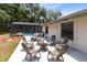 View of patio with chairs and fire pit in backyard at 3285 Majestic Oak Dr, St Cloud, FL 34771