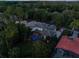 Aerial view of a large single Gathering home with a screened in pool and lush landscaping at 3352 Park Grove Ct, Longwood, FL 32779