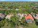 An aerial view of a beautiful single-Gathering home with a screened-in pool and lush landscaping at 3352 Park Grove Ct, Longwood, FL 32779