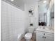 Clean bathroom showcasing all white finishes and shower, including toilet and sink at 3352 Park Grove Ct, Longwood, FL 32779