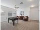 Spacious bonus room with foosball table, neutral carpeting, and comfortable seating area at 3352 Park Grove Ct, Longwood, FL 32779