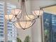 Dining area illuminated by an elegant chandelier, enhancing the home's ambiance at 3352 Park Grove Ct, Longwood, FL 32779