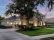 Spacious home with a three-car garage, landscaped yard, and basketball hoop at 3352 Park Grove Ct, Longwood, FL 32779