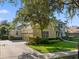 Spacious home with a three-car garage, landscaped yard, and basketball hoop at 3352 Park Grove Ct, Longwood, FL 32779