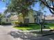 A suburban home with a lush green lawn and mature trees providing shade and curb appeal at 3352 Park Grove Ct, Longwood, FL 32779