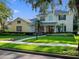 Charming two-story home with a landscaped front yard, illuminated walkway and welcoming double-door entrance at 3352 Park Grove Ct, Longwood, FL 32779