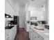 Bright kitchen featuring white cabinets, stainless appliances, and a center island with counter seating at 3352 Park Grove Ct, Longwood, FL 32779