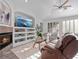 Inviting living room with a fireplace, entertainment center, and bright natural light at 3352 Park Grove Ct, Longwood, FL 32779