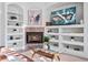 Cozy fireplace and entertainment center creating a comfortable living space at 3352 Park Grove Ct, Longwood, FL 32779