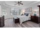 Bright main bedroom with tray ceiling, light colored walls, and luxury vinyl floors at 3352 Park Grove Ct, Longwood, FL 32779