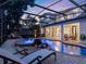 Lounge by this private pool and spa featuring a screened-in patio and manicured landscaping at 3352 Park Grove Ct, Longwood, FL 32779