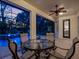Covered outdoor pool area featuring outdoor furniture and a beautiful twilight sky at 3352 Park Grove Ct, Longwood, FL 32779