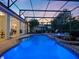 Wide angle outdoor pool featuring an integrated jacuzzi and beautiful twilight sky at 3352 Park Grove Ct, Longwood, FL 32779