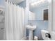 This cozy bathroom has a standing sink, a shower, and a toilet at 3714 Paige St, Port Orange, FL 32127