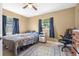 This sunny bedroom features a nice window, a bed, and a work station at 3714 Paige St, Port Orange, FL 32127