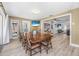 This airy dining room boasts a large wooden table, seating for eight, and an open view to the living room at 3714 Paige St, Port Orange, FL 32127