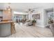 Open-concept dining area with modern lighting, comfortable seating, and seamless transition to kitchen at 3714 Paige St, Port Orange, FL 32127