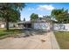 Charming single-story home with stone accents and a well-maintained front yard under a bright, sunny sky at 3714 Paige St, Port Orange, FL 32127