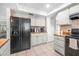 Efficient kitchen layout with updated appliances, ample storage, and a view into the open living space at 3714 Paige St, Port Orange, FL 32127