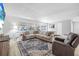 Spacious living room with large windows, plush seating, and stylish decor, creating a cozy atmosphere at 3714 Paige St, Port Orange, FL 32127