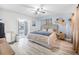 The bright main bedroom features a decorative wall, a ceiling fan, and an outdoor entrance at 3714 Paige St, Port Orange, FL 32127