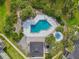 Aerial view of the community pool and surrounding landscaped grounds at 3721 S Lake Orlando Pkwy # 05, Orlando, FL 32808
