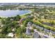 Aerial view showcases an apartment complex near a lake and ponds surrounded by trees and mature landscaping at 3721 S Lake Orlando Pkwy # 05, Orlando, FL 32808