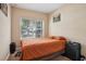 Bedroom featuring a cozy bed, large window, and ample space for relaxation at 3721 S Lake Orlando Pkwy # 05, Orlando, FL 32808