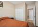 Bedroom featuring a cozy bed and a closet door leading to another room at 3721 S Lake Orlando Pkwy # 05, Orlando, FL 32808