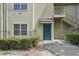 Close-up of a unit entrance with blue door, stairway, and small front garden at 3721 S Lake Orlando Pkwy # 05, Orlando, FL 32808
