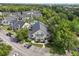 Aerial view of an apartment building in a residential neighborhood with parking and mature trees with landscaping at 3721 S Lake Orlando Pkwy # 05, Orlando, FL 32808