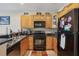 Well-equipped kitchen features wood cabinetry, granite countertops and a black appliance package at 3721 S Lake Orlando Pkwy # 05, Orlando, FL 32808