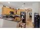 Well-equipped kitchen features wood cabinetry, granite countertops and a black appliance package at 3721 S Lake Orlando Pkwy # 05, Orlando, FL 32808
