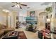 Inviting living room features tile floors, a ceiling fan, and a wall mounted entertainment center at 3721 S Lake Orlando Pkwy # 05, Orlando, FL 32808
