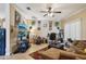 Comfortable living room features tile floors, a ceiling fan, and a work space at 3721 S Lake Orlando Pkwy # 05, Orlando, FL 32808