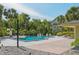Sparkling community swimming pool surrounded by palm trees and a well-maintained deck at 3721 S Lake Orlando Pkwy # 05, Orlando, FL 32808