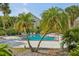 Community swimming pool with lounge chairs and palm trees at 3721 S Lake Orlando Pkwy # 05, Orlando, FL 32808