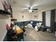 Spare bedroom featuring a day bed, mounted television and built-in shelving at 4297 Abaco Dr, Tavares, FL 32778