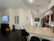 Open-concept kitchen with a breakfast bar, wooden cabinets, and stainless steel appliances at 4297 Abaco Dr, Tavares, FL 32778