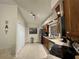 Well-lit kitchen featuring ample counter space and wooden cabinetry with stainless steel appliances at 4297 Abaco Dr, Tavares, FL 32778