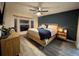 Modern main bedroom with a king-size bed, bay windows, and stylish decor at 4297 Abaco Dr, Tavares, FL 32778