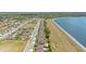 Aerial view of a community with lake views and well-maintained homes at 455 Lazio Cir, Debary, FL 32713
