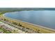 Community aerial view showcases many homes near lake at 455 Lazio Cir, Debary, FL 32713