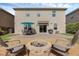 Beautiful backyard with a fire pit, outdoor seating, and a patio dining area at 455 Lazio Cir, Debary, FL 32713