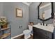 Nicely decorated half bathroom with vanity and decorative mirror at 455 Lazio Cir, Debary, FL 32713
