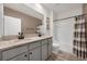 Well-lit bathroom with dual sinks, granite countertops, and a shower-tub combination at 455 Lazio Cir, Debary, FL 32713