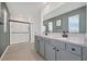 Spacious bathroom featuring dual vanity with granite countertop and a sleek glass-enclosed shower at 455 Lazio Cir, Debary, FL 32713